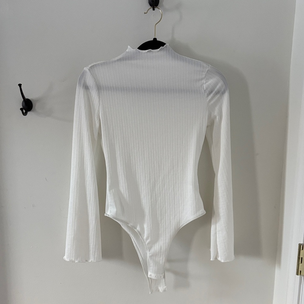 White Amazon bodysuit, size small.